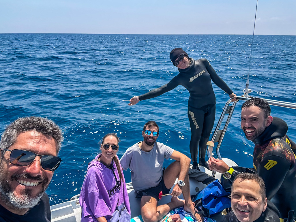 The Blue Experience team smiling on the boat off Larnaca